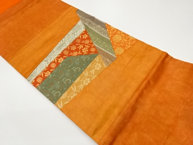 Nagoya obi with a classic pattern woven into a kurimeted flower arabesque